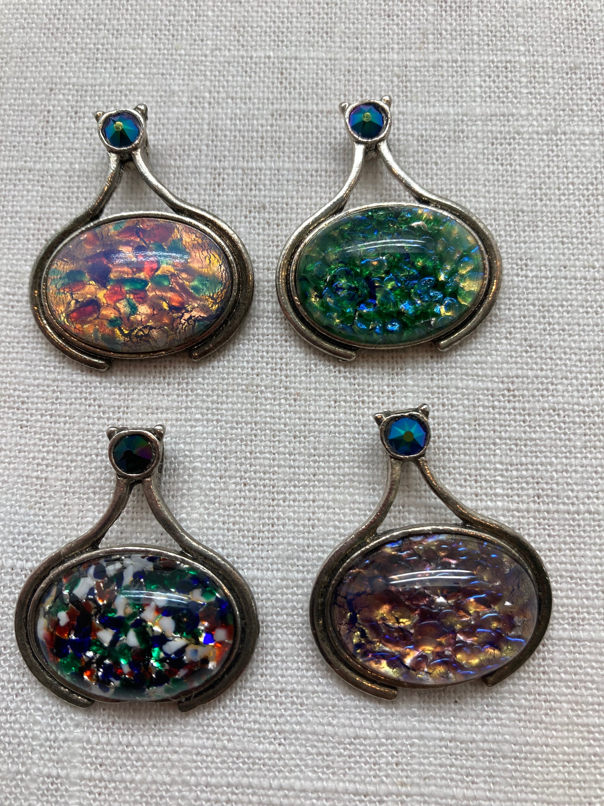 oval glass pendants finished with Swarovski cabochon