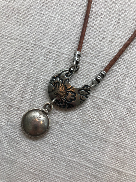 solid antique silver plated charm on brown leather necklace