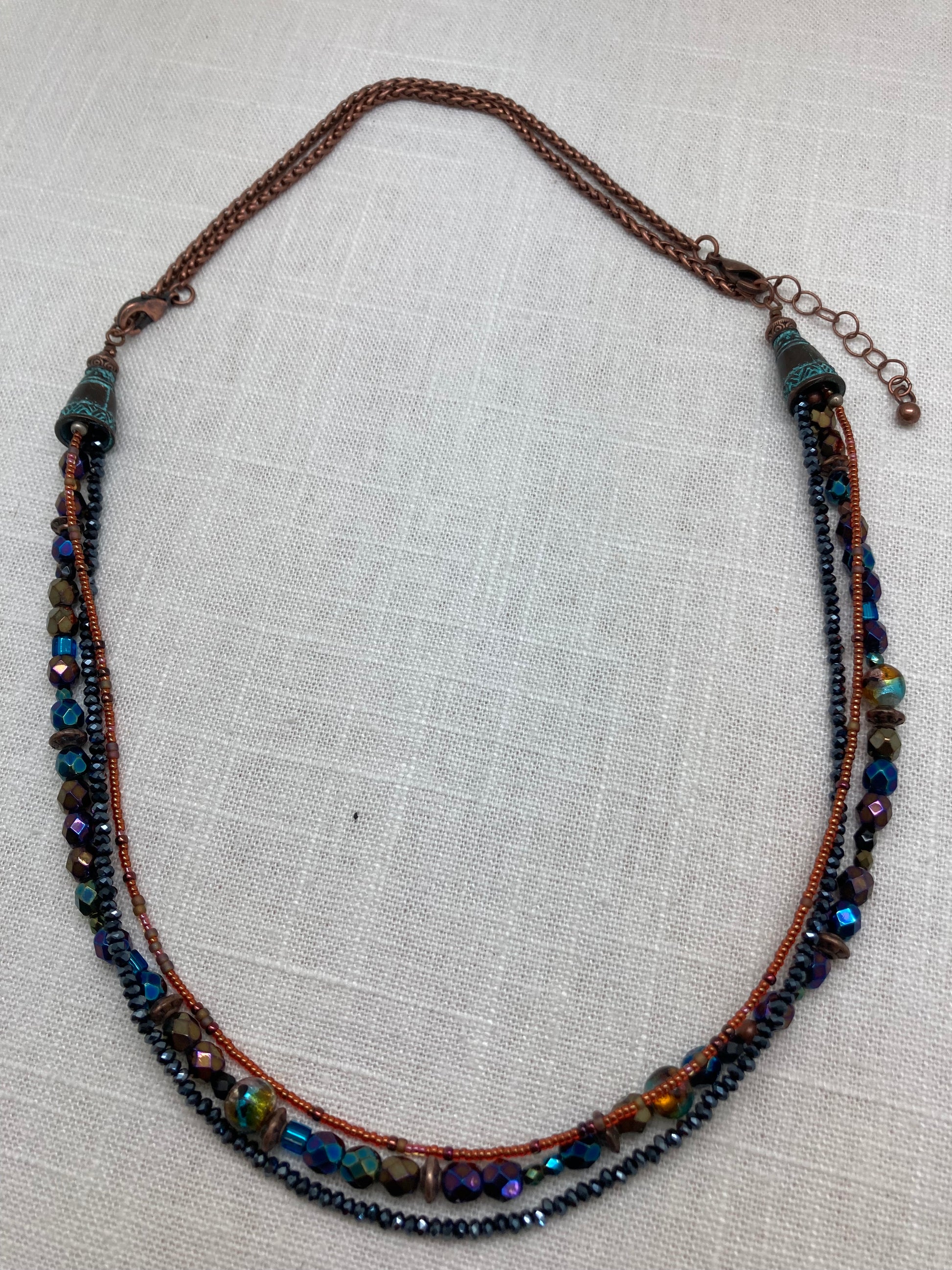 three strand blue and orange beaded necklace