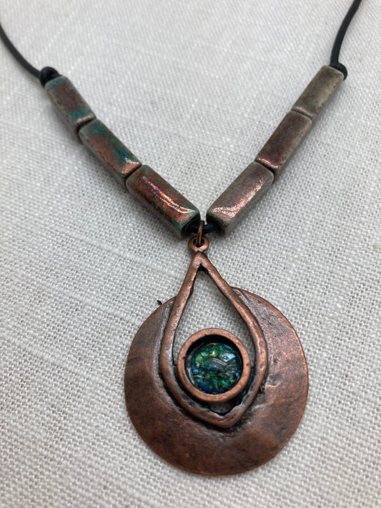 knotted leather necklace with raku beads and antique copper pendant with a green glass cabachon