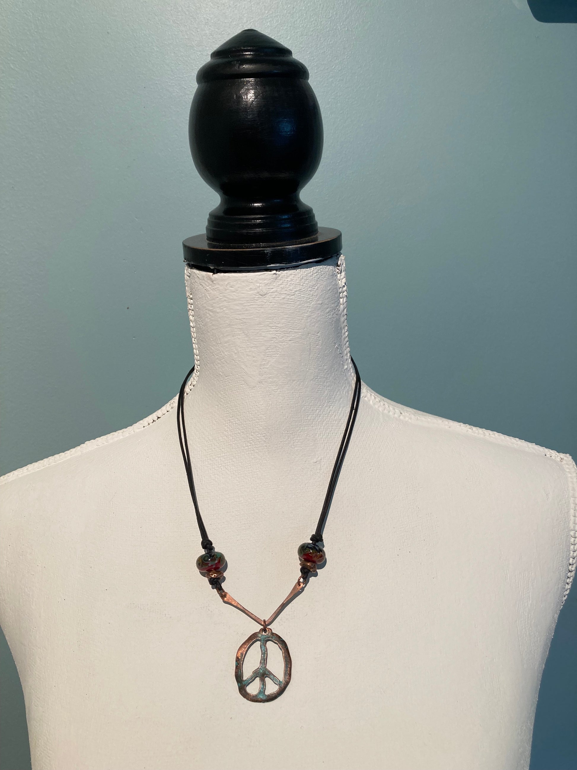 knotted leather peace sign necklace with glass beads