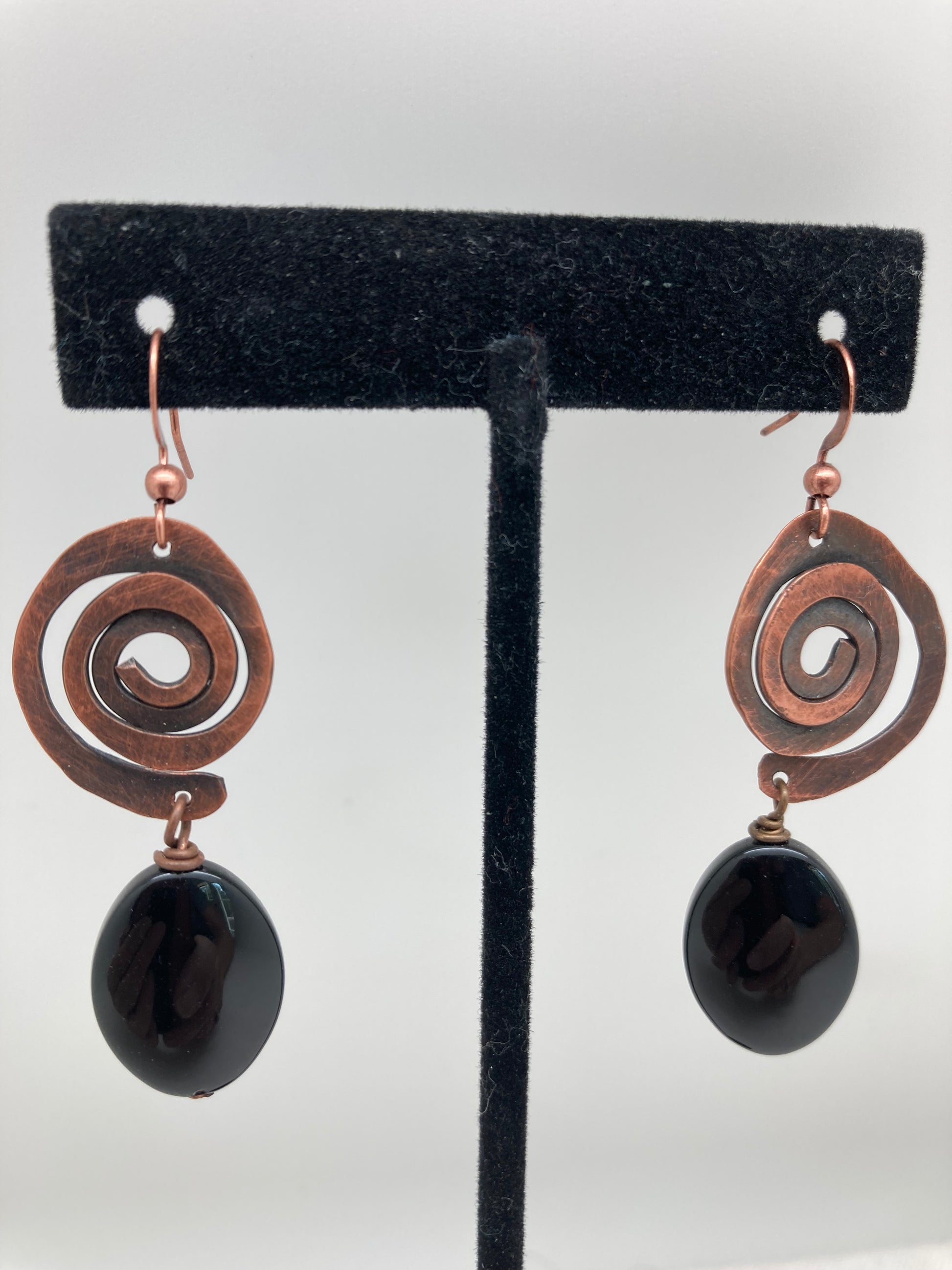 copper swirl dangle earrings with onyx drop