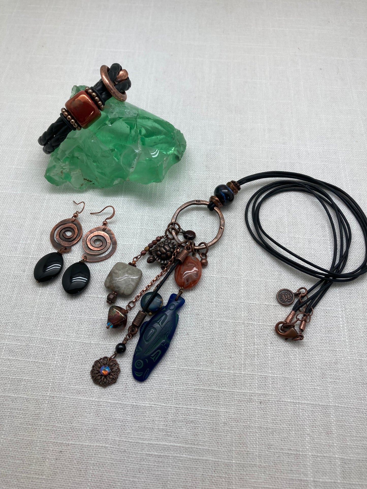 leather and copper necklace with dangling charms