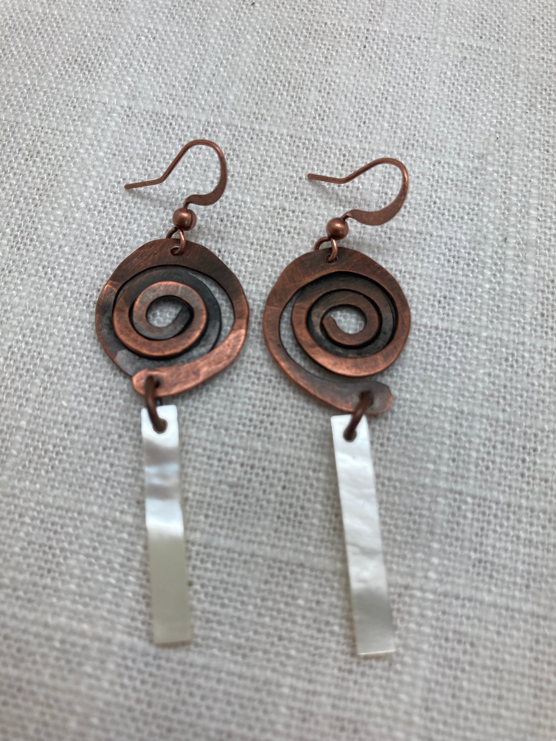 copper spiral earrings with mother-of-pearl bar dangle