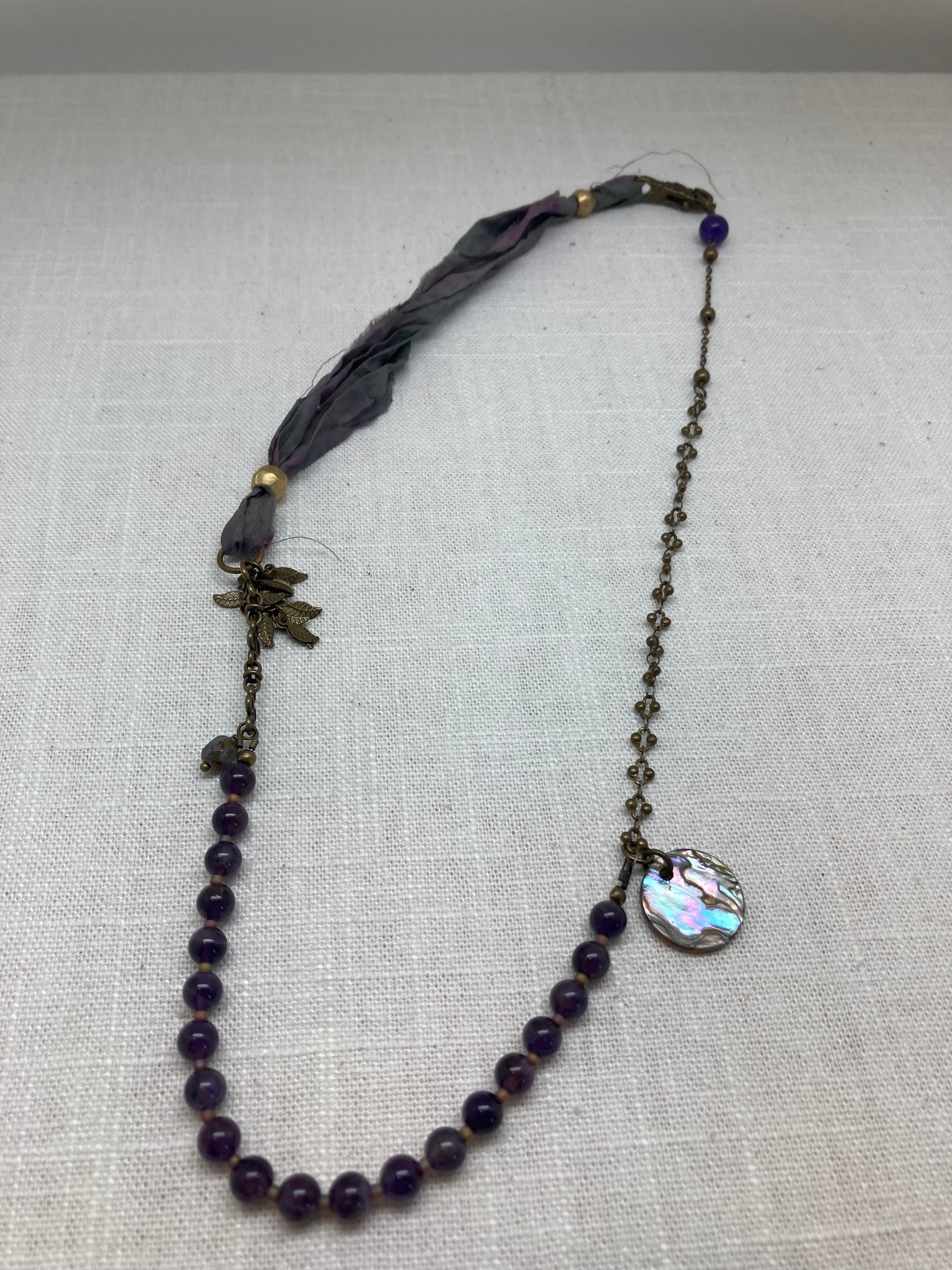 amethyst colored necklace with mixed materials
