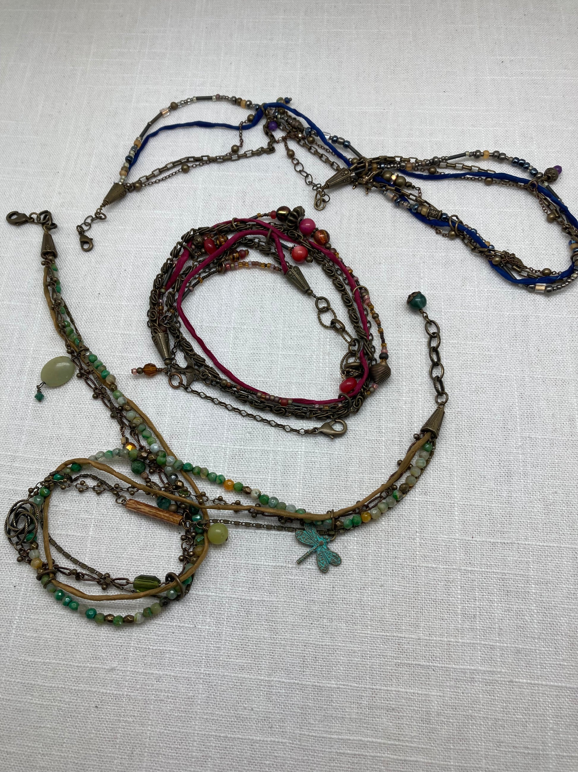 silk and brass necklaces