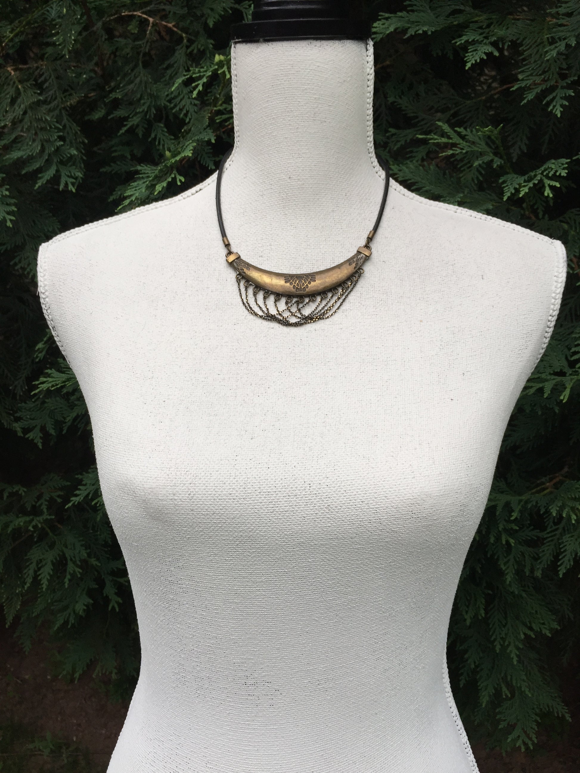 adjustable leather necklace with stamped and oxidized brass pendant