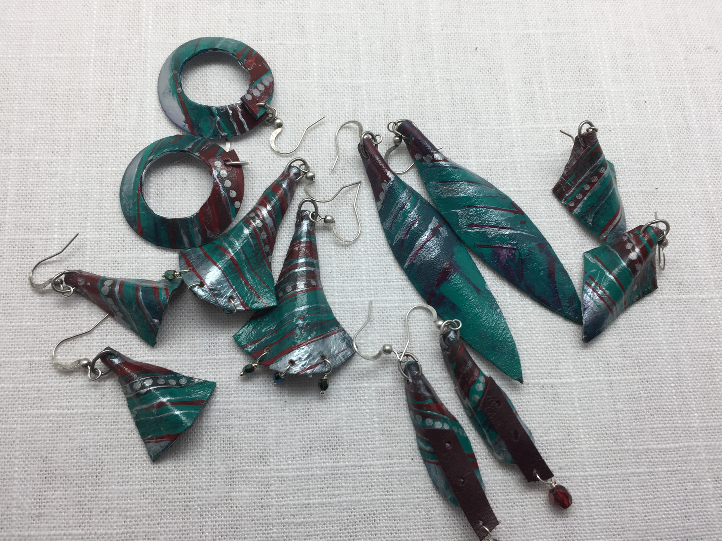 teal and silver painted leather earrings