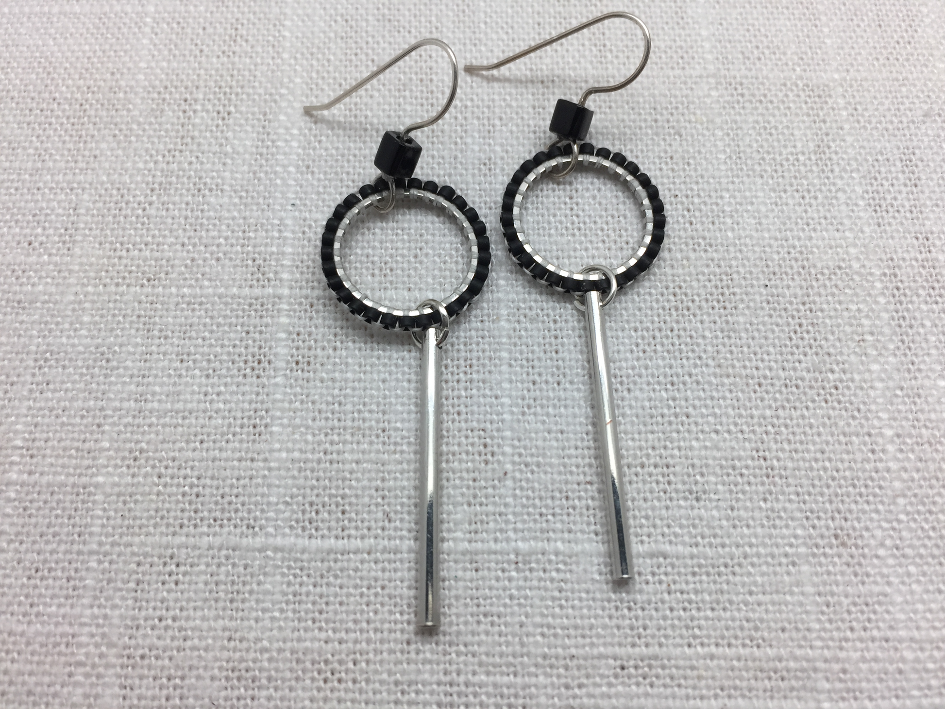 beaded silver loop dangle earrings