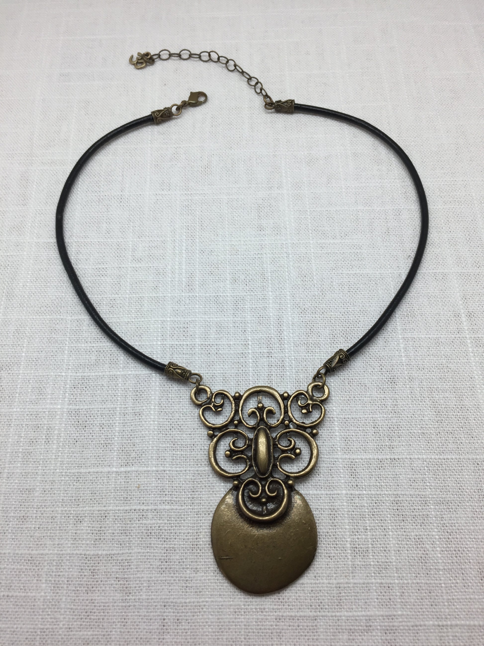 antiqued brass pendant necklace with leather cord