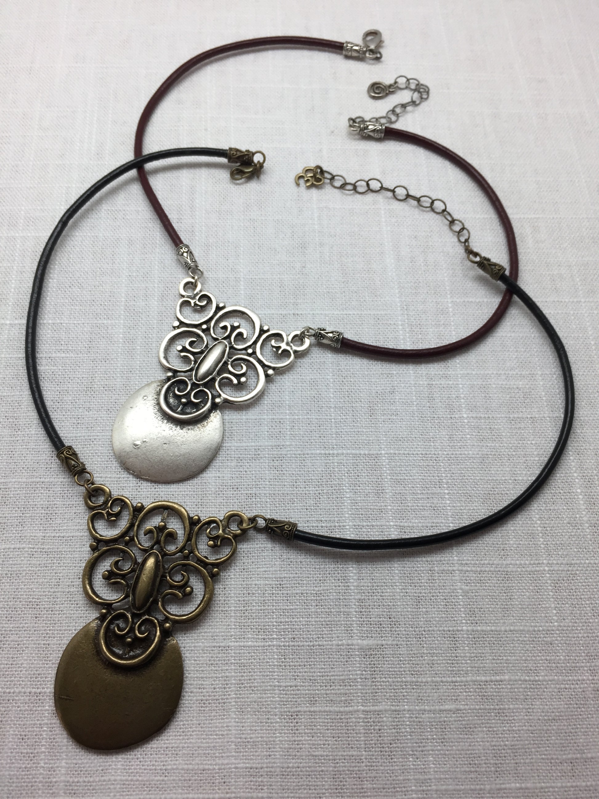 brass necklace with black leather cord