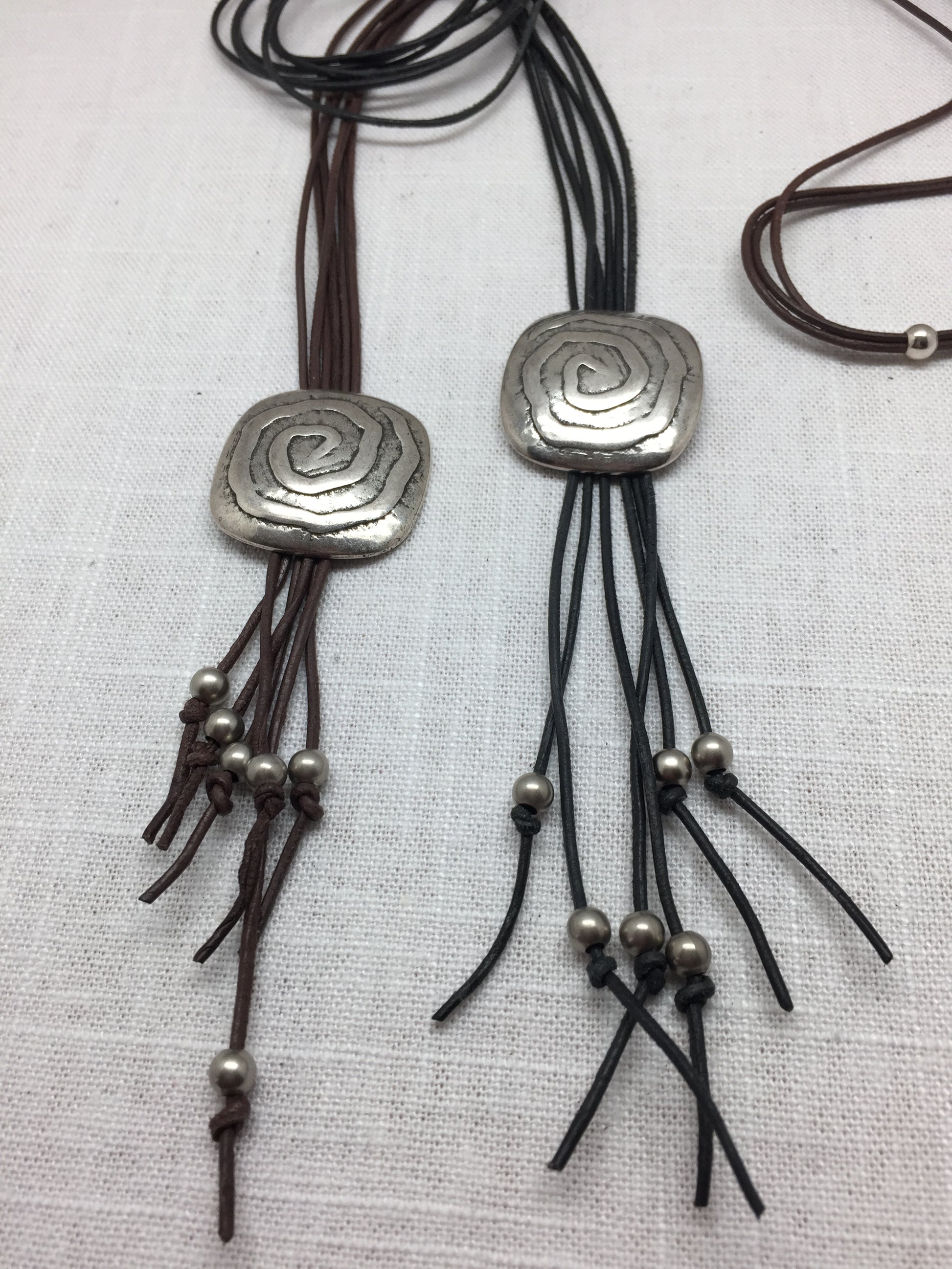 leather necklace with silver medallion