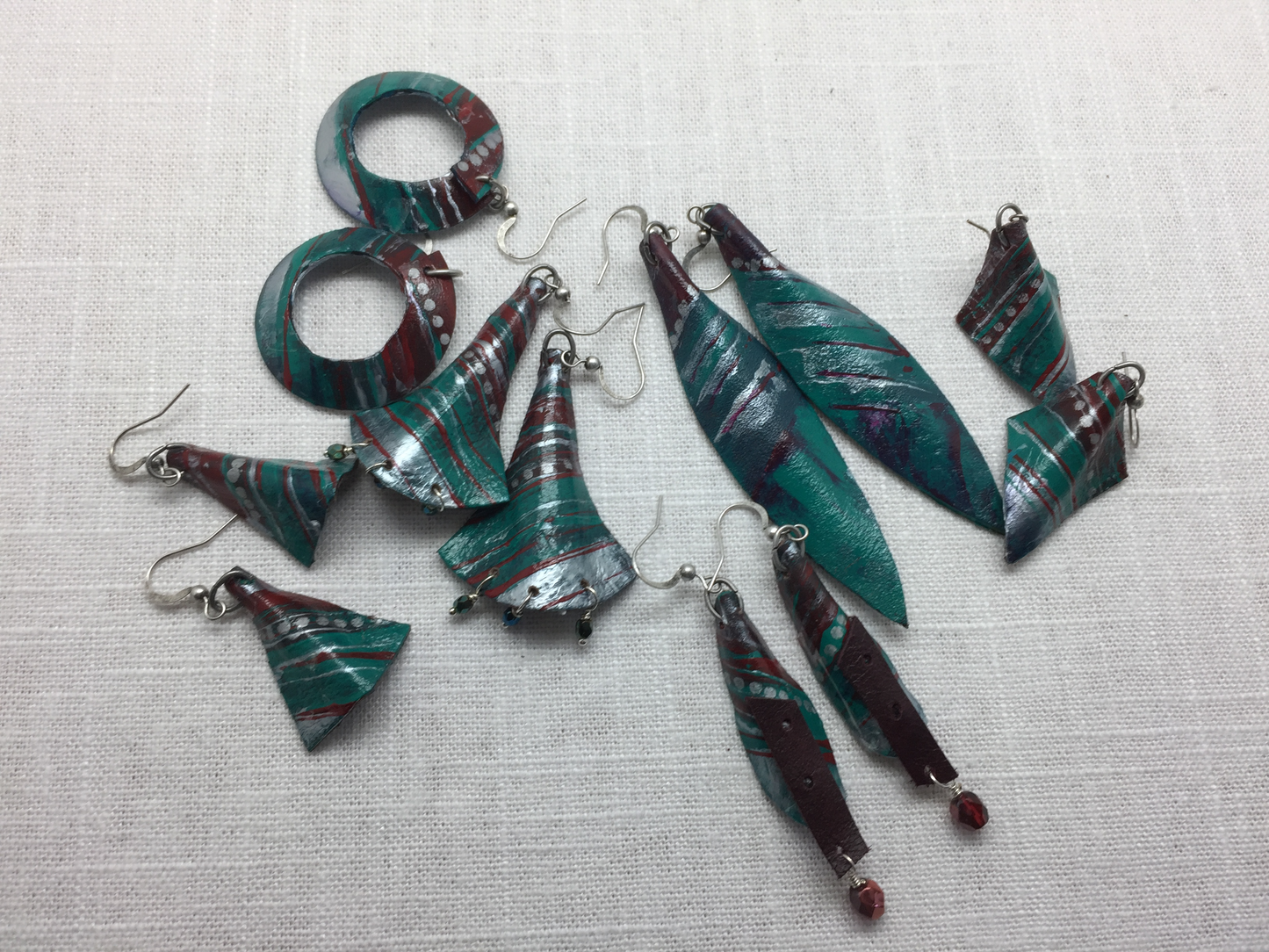 teal and silver painted leather earrings