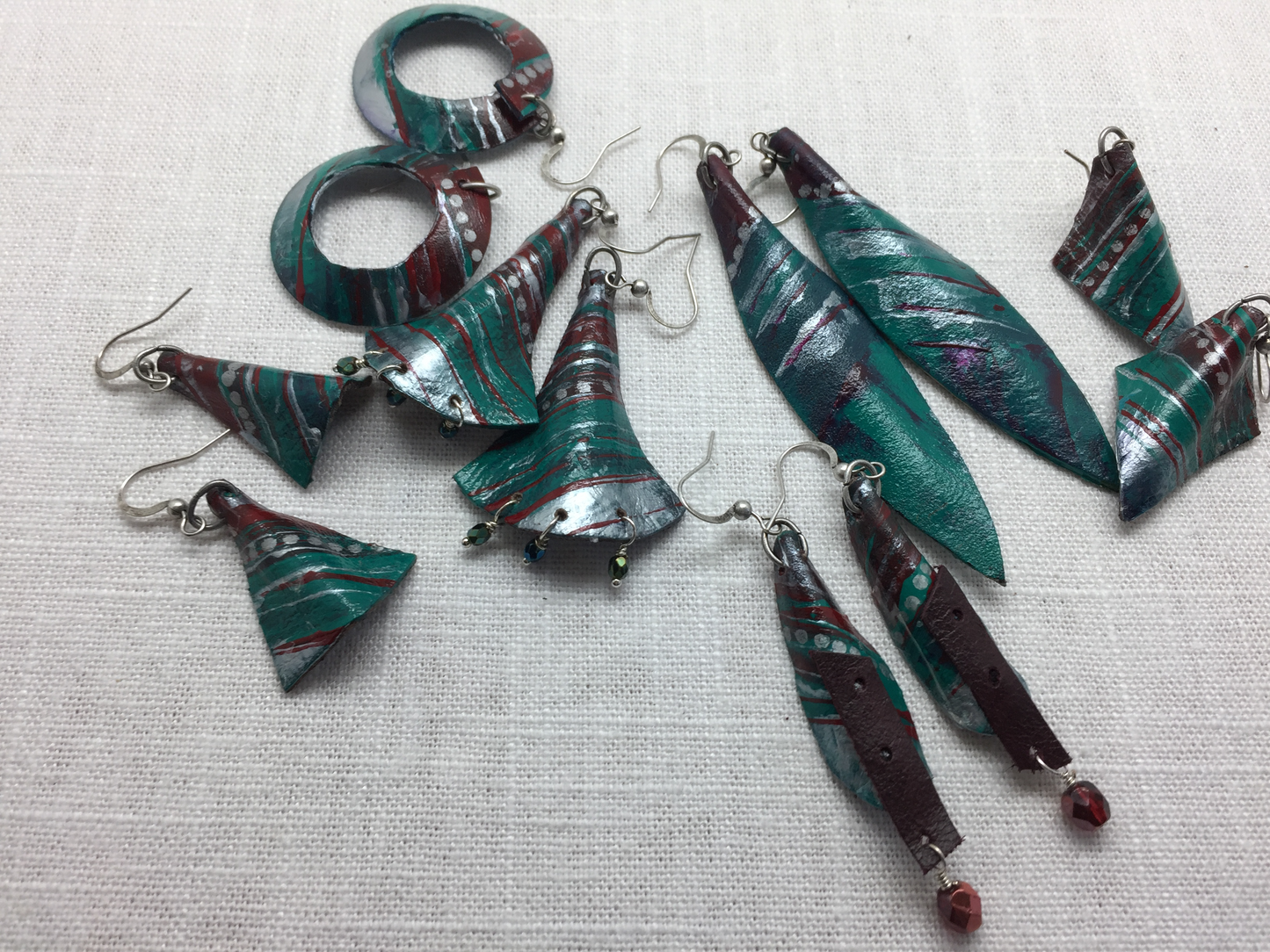 teal and silver painted leather earrings