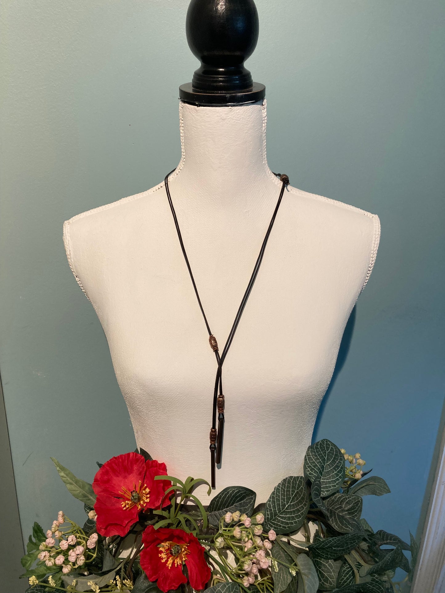 long leather lariat necklace with copper bar