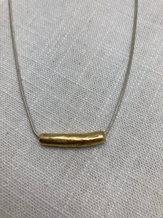 gold tube necklace on silver chain