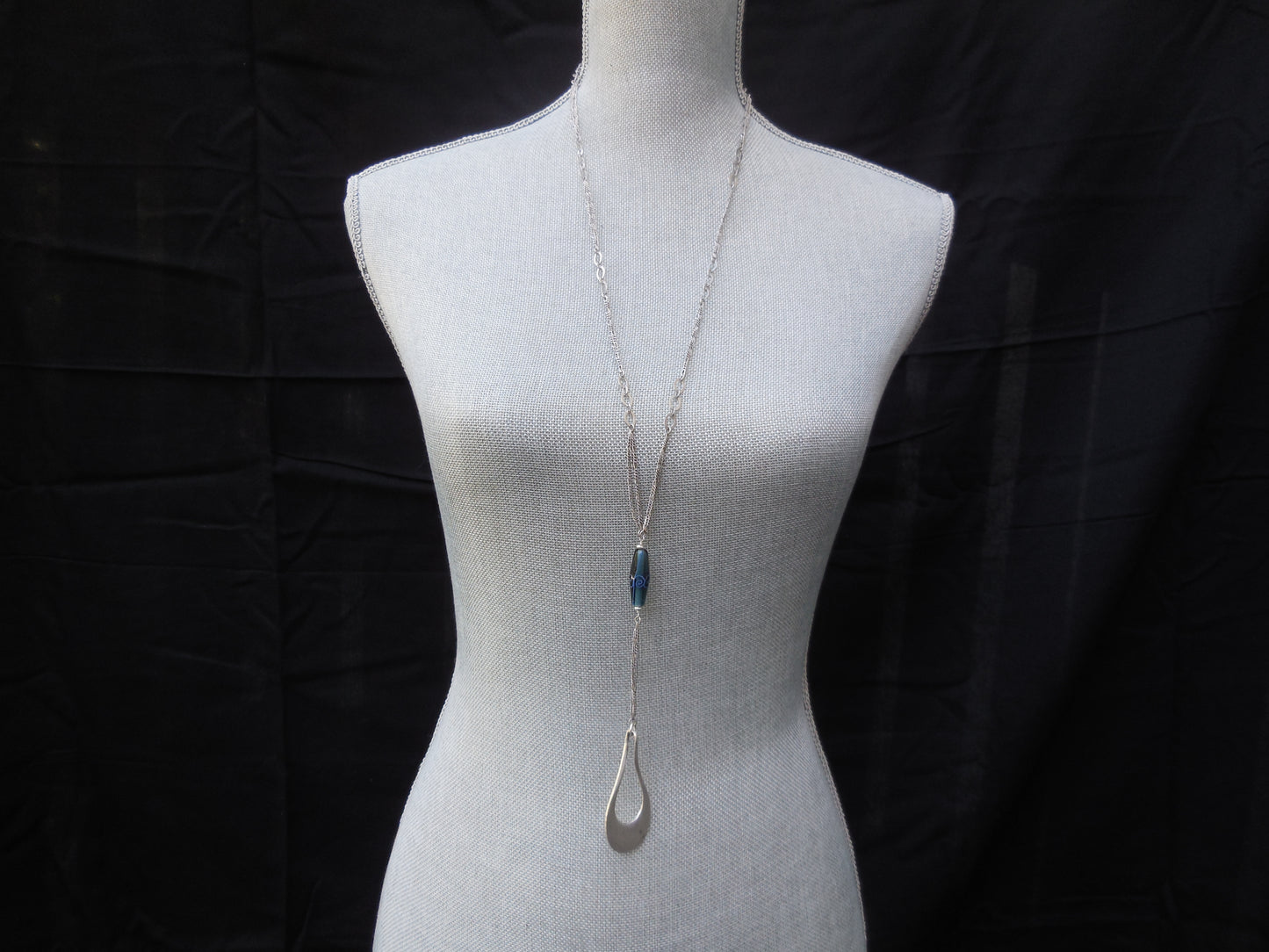extra long silver necklace with blue glass bead